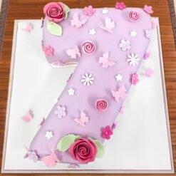 Floral-themed Number Seven Cake decorated with beautiful blooms, pastel frosting, and elegant details for a charming birthday celebration.