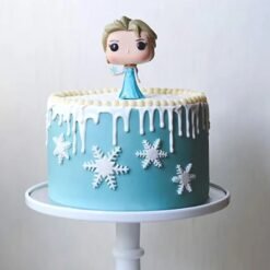 Frozen Enchantment Cake featuring icy blue accents, snowflakes, and magical designs, capturing the essence of a frozen wonderland.