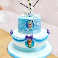 Frozen Dreams Cake with icy blue and white decorations, featuring snowflakes and frosty details.