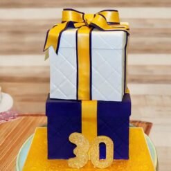 Charming Gift Box Cake designed with intricate details, complete with fondant ribbons and bows for a luxurious celebration.