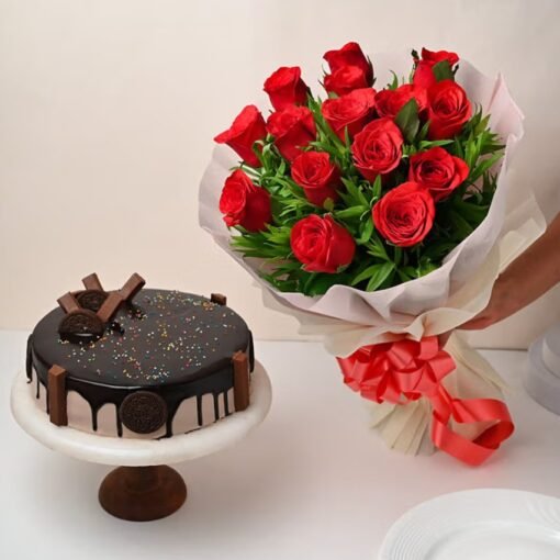KitKat Cake surrounded by chocolate bars and vibrant red roses in a bouquet, creating a beautiful and delicious gift combination.