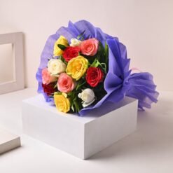 A beautiful bouquet of colorful roses in shades of red, yellow, pink, and orange, arranged elegantly for gifting.