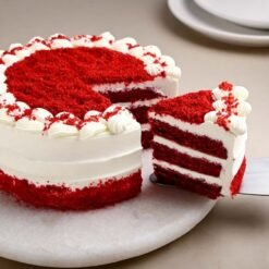 Velvet Royale Cake with layers of rich red velvet and creamy frosting, ideal for elegant celebrations and special moments.