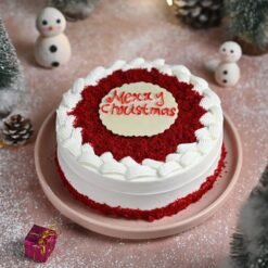 Christmas Crimson Bliss Cake with red velvet layers, creamy frosting, and festive holiday decorations, ideal for Christmas celebrations.