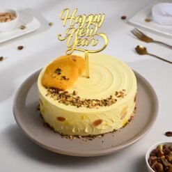 Festive Rasmalai New Year Cake, a beautifully decorated dessert with rich Rasmalai flavors, perfect for adding sweetness to your New Year celebration.