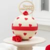 Happy Anniversary Pinata Cake with a heart-themed design, filled with hidden treats, perfect for romantic anniversaries and special celebrations.