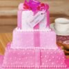 Present Party Tier Cake with multiple tiers, decorated with a gift box theme, perfect for festive occasions.