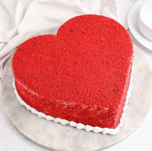 Heart-shaped Red Velvet Cake with cream cheese frosting, designed to add a romantic touch to your celebrations.