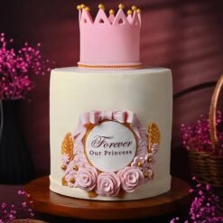 Elegant Crown Celebration Cake adorned with royal crown toppers and luxurious designs.