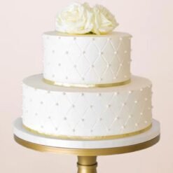 Pure Elegance Wedding Cake featuring intricate floral designs, smooth fondant layers, and elegant tiers for a luxurious wedding centerpiece.