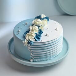 Designer Vanilla Dream Cake, a beautifully designed cake featuring smooth vanilla layers and exquisite decoration, perfect for any special event.