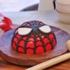 Spiderman Pinata Cake with a vibrant Spiderman design and filled with candies or treats, perfect for a superhero-themed birthday party.