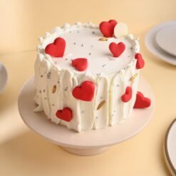 Little Hearts Red Velvet Cake featuring layers of rich red velvet and heart-shaped decoration, ideal for celebrating love and special occasions.