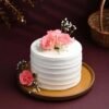 Rosy Vanilla Harmony Cake featuring smooth vanilla layers with a rosy pink decoration, creating a delicate and elegant dessert.