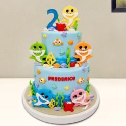 Baby Sharks Tier Cake decorated with fun, colorful baby sharks, sea creatures, and ocean-themed details for a playful party.