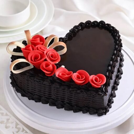 Heartfelt Truffle Love Cake with smooth chocolate ganache and elegant heart-shaped decorations.